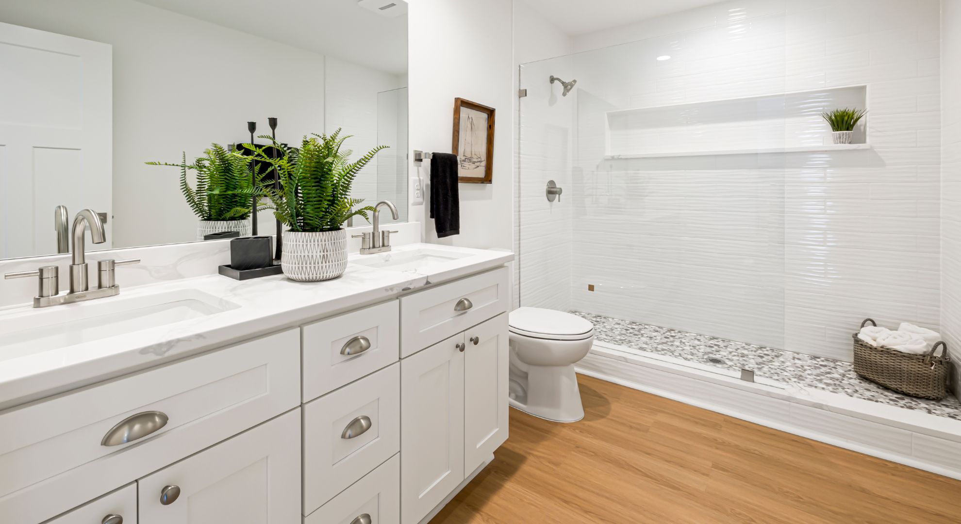 white bathroom with potted plant